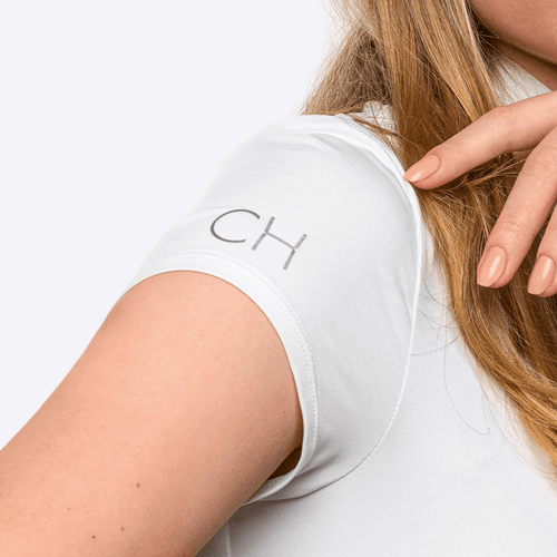 Close-up of short sleeve of Anna Klose competition shirt for equestrian women personalized with silver initials