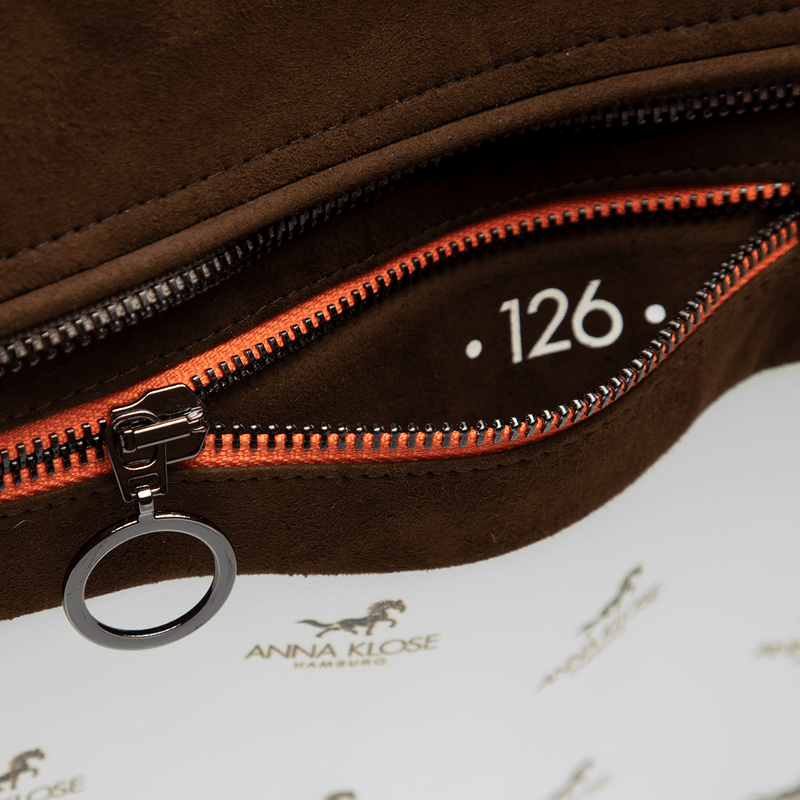Interior shot of a brown horse riding equipment bag with inside pocket zipper