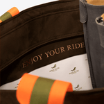 Close up of the lining of a brown horse riding equipment bag with a personalized inscription