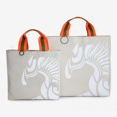 Two horse riding equipment bags made of light beige vegan leather with white logo made of vegan leather by Anna Klose Hamburg