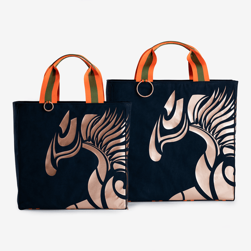 Two horse riding equipment bags made of blue vegan leather with rose golden logo by Anna Klose Hamburg