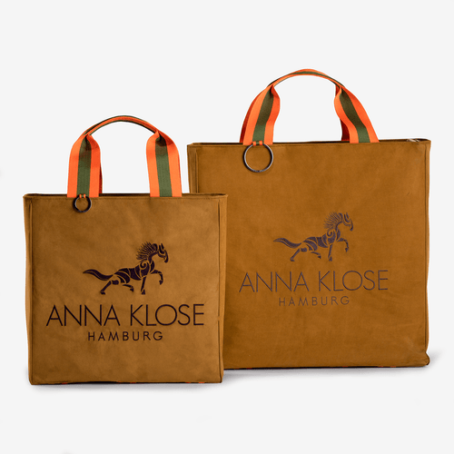 Two horse riding equipment bags made brown of vegan leather with dark embroidered logo by Anna Klose Hamburg