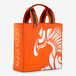 Horse riding equipment bag made of orange vegan leather with white logo horse of the brand Anna Klose Hamburg