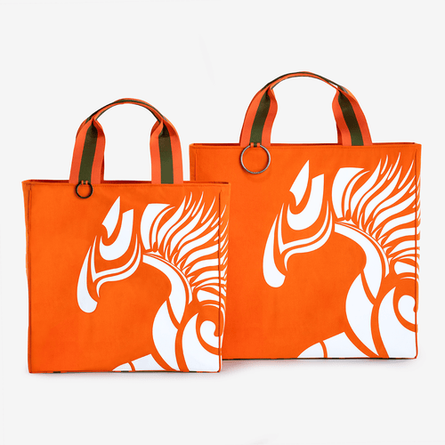 Two horse riding equipment bags made of orange vegan leather with white logo made of vegan leather by Anna Klose Hamburg