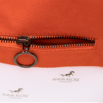 Interior shot of an orange horse riding equipment bag with inside pocket zipper