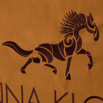 Close up of the embroidered logo horse on the brown Anna Klose horse riding equipment bag