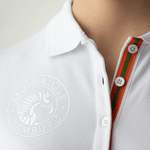 Close-up of the logo printed in silver on a white long-sleeved polo shirt by Anna Klose Hamburg