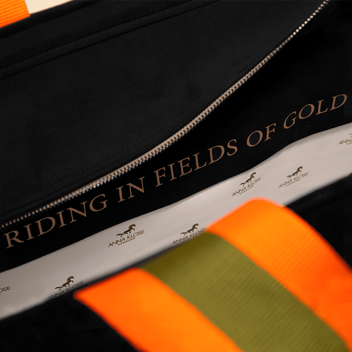 Close up of the lining of a black horse riding equipment bag with a personalized inscription