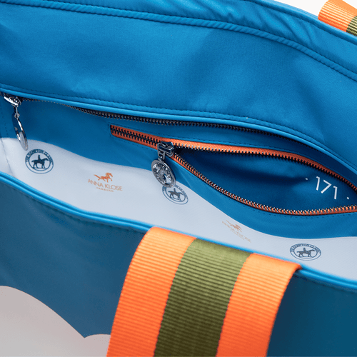 Interior shot of a blue horse riding equipment bag with inside pocket zipper
